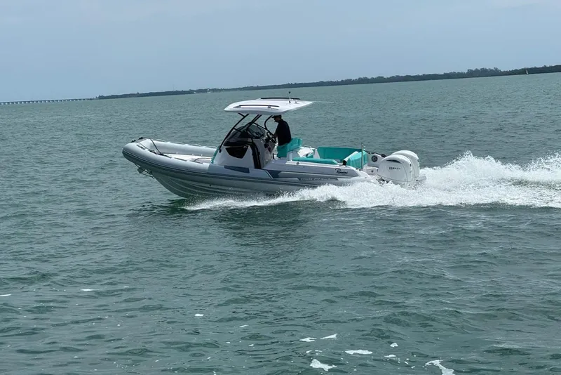 Slide: The Image of 2026 Ranieri CAYMAN 27.0 SPORT TOURING boat cruising on open water. - 5