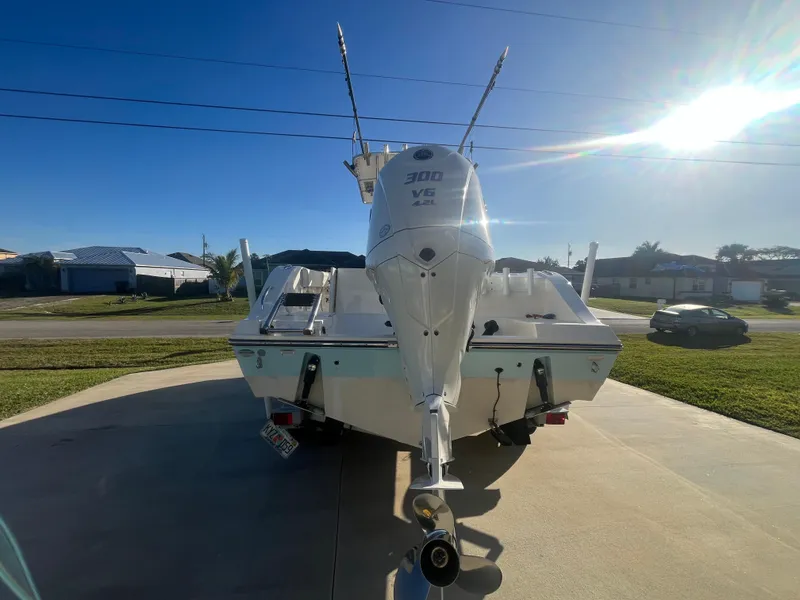 Slide: The Image of 2019 Cobia 237 Center Console boat with Yamaha 300 outboard engine in driveway. - 16