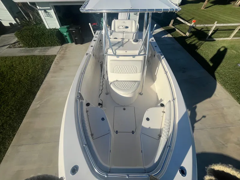 Slide: The Image of 2019 Cobia 237 Center Console boat, aerial view, spacious deck, white exterior. - 32