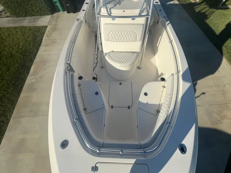 Slide: The Image of 2019 Cobia 237 Center Console boat, top view of bow seating and storage compartments. - 34