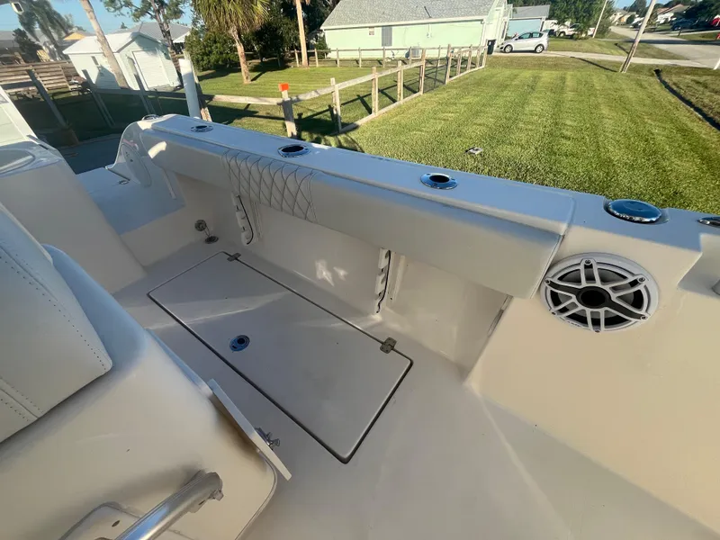 Slide: The Image of 2019 Cobia 237 Center Console boat interior with storage and speaker. - 39