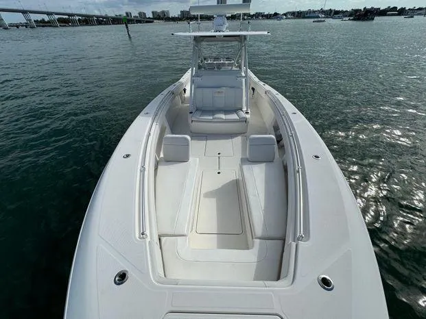 Slide: The Image of 2015 Invincible 39 Open Fisherman boat on water, spacious deck view. - 16