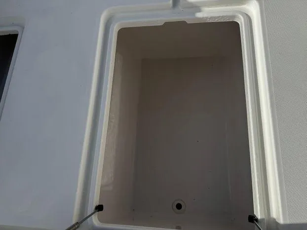 Slide: The Image of Open storage compartment on 2015 Invincible 39 Open Fisherman boat. - 28