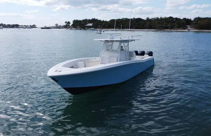 Slide: The Image of 2015 Invincible 39 Open Fisherman boat on calm water. - 3