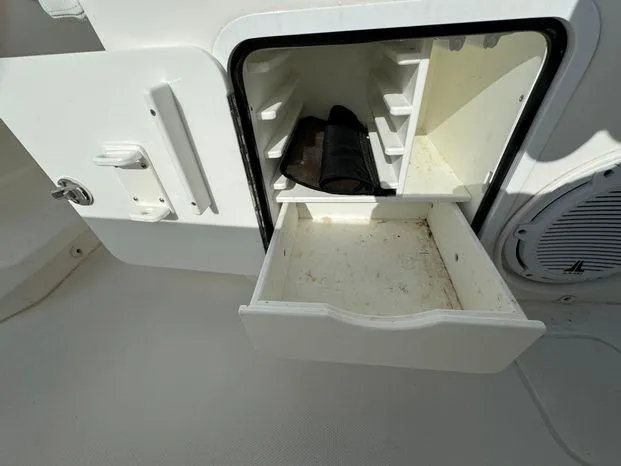 Slide: The Image of Open storage compartment on 2015 Invincible 39 Open Fisherman boat. - 36