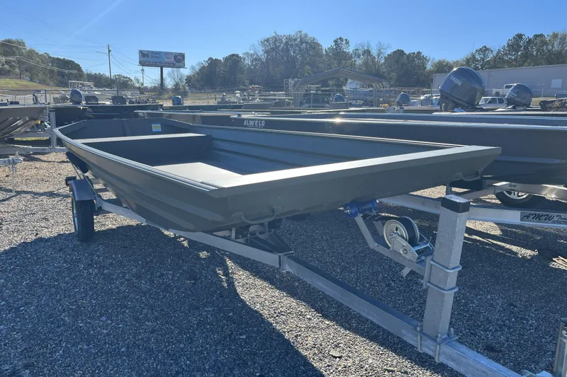 Slide: The Image of 2026 Alweld 1648 Marsh Jon boat on trailer, displayed outdoors. - 9