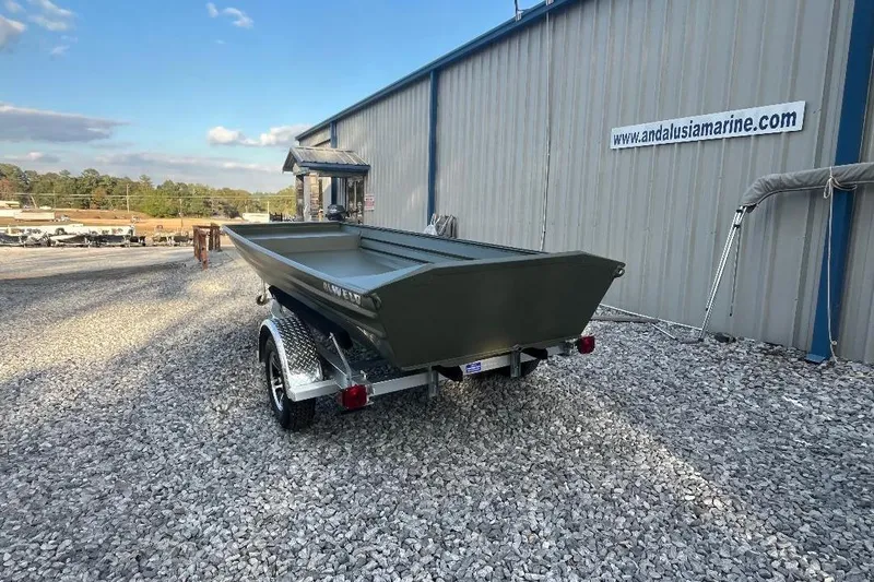 Slide: The Image of 2026 Alweld 1648 Marsh Jon boat on trailer outside Andalusia Marine. - 3