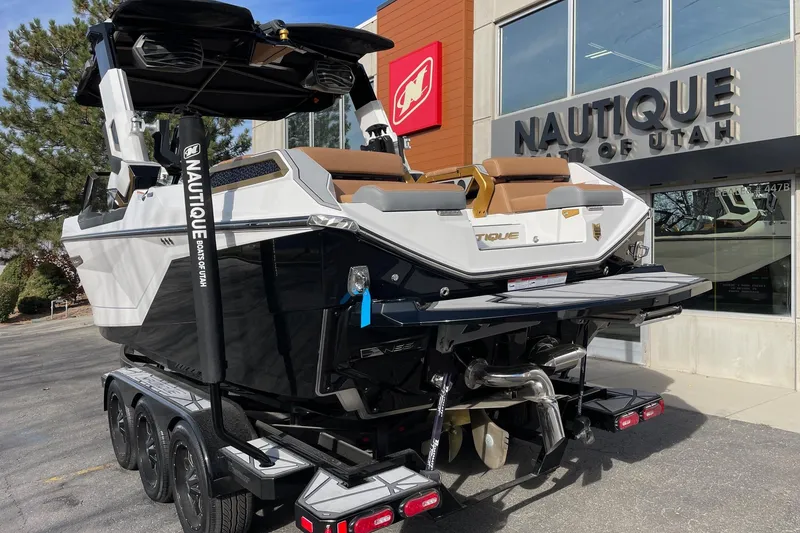 Slide: The Image of 2024 Nautique Super Air Nautique G23 Paragon boat at dealership, rear view. - 3