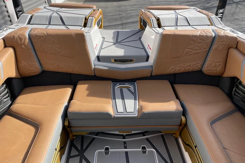 Slide: The Image of 2024 Nautique Super Air Nautique G23 Paragon interior with luxurious tan seating. - 8