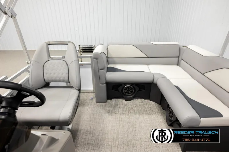 Slide: The Image of 2026 Avalon VEN CR boat interior with modern seating and steering area. - 14