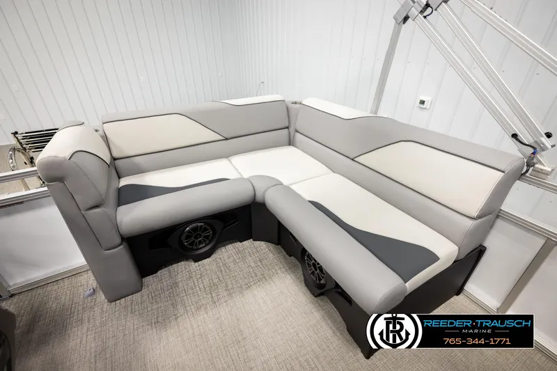 Slide: The Image of 2026 Avalon VEN CR boat interior with gray and white seating, featuring built-in speakers. - 20