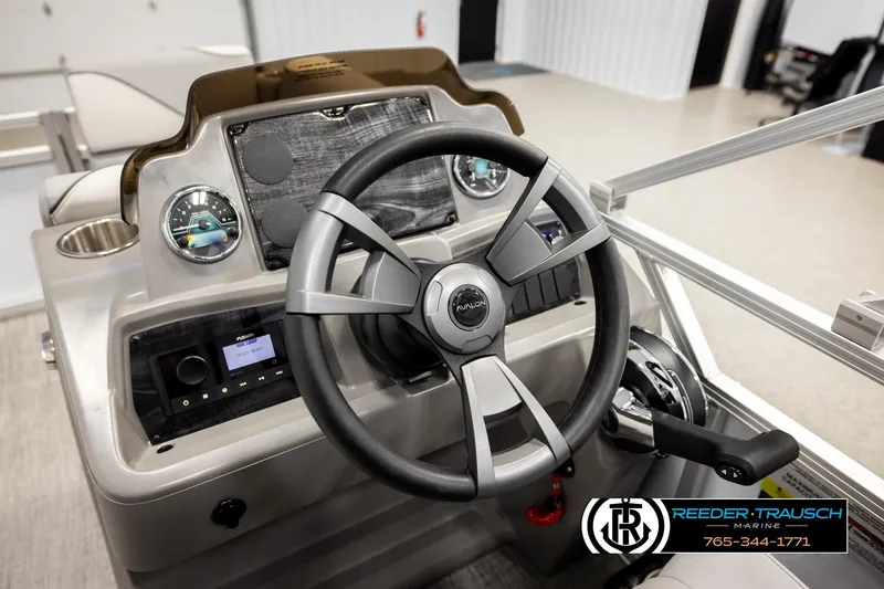 Slide: The Image of 2026 Avalon VEN CR boat dashboard with steering wheel and control panel. - 23
