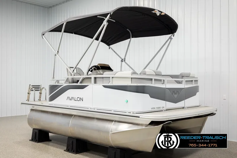 Slide: The Image of 2026 Avalon VEN CR pontoon boat with canopy in showroom. - 3
