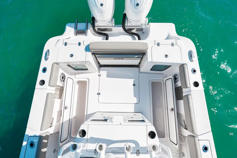 Slide: The Image of Manufacturer Provided Image: 2025 Sportsman Open 282 Center Console boat deck on turquoise water. - 17