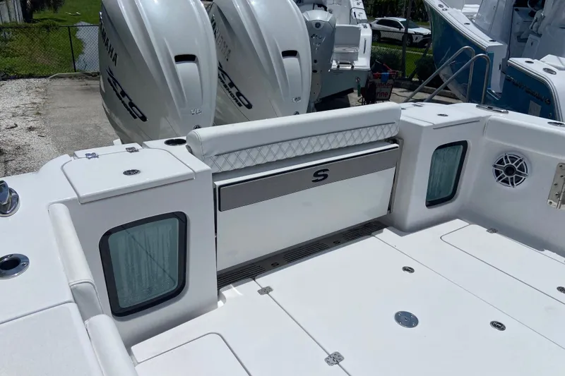 Slide: The Image of 2026 Sportsman Open 322 Center Console boat with Yamaha engines, featuring spacious deck and seating. - 3