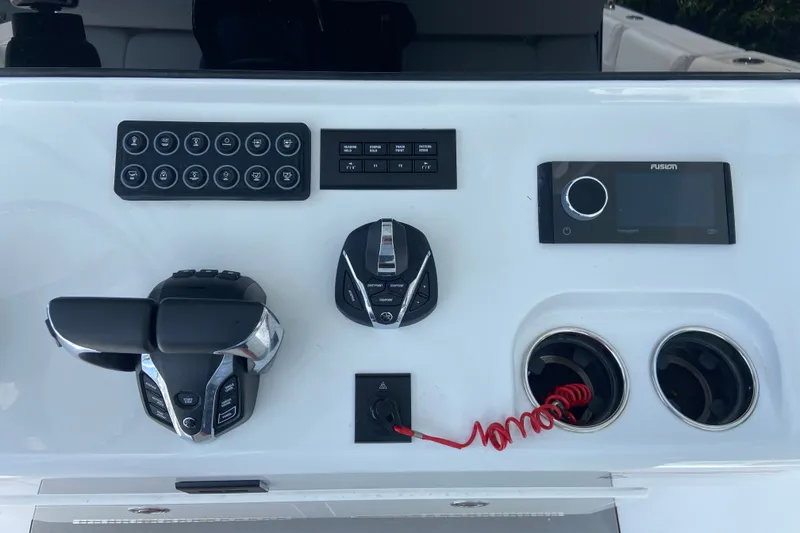 Slide: The Image of Control panel of 2026 Sportsman Open 322 Center Console boat with modern navigation features. - 22
