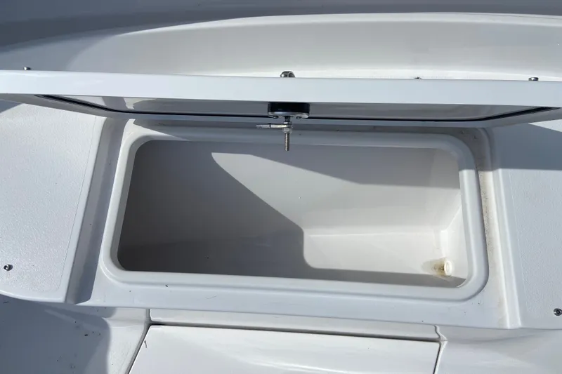 Slide: The Image of Open storage compartment on 2026 Sportsman Open 322 Center Console boat. - 30