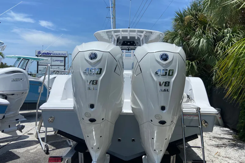 Slide: The Image of 2026 Sportsman Open 322 Center Console with twin Yamaha 450 V8 engines at Thunder Marine. - 1