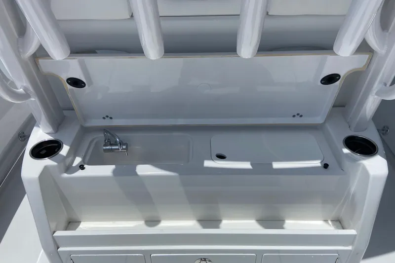 Slide: The Image of 2026 Sportsman Open 322 Center Console boat sink and storage area. - 15