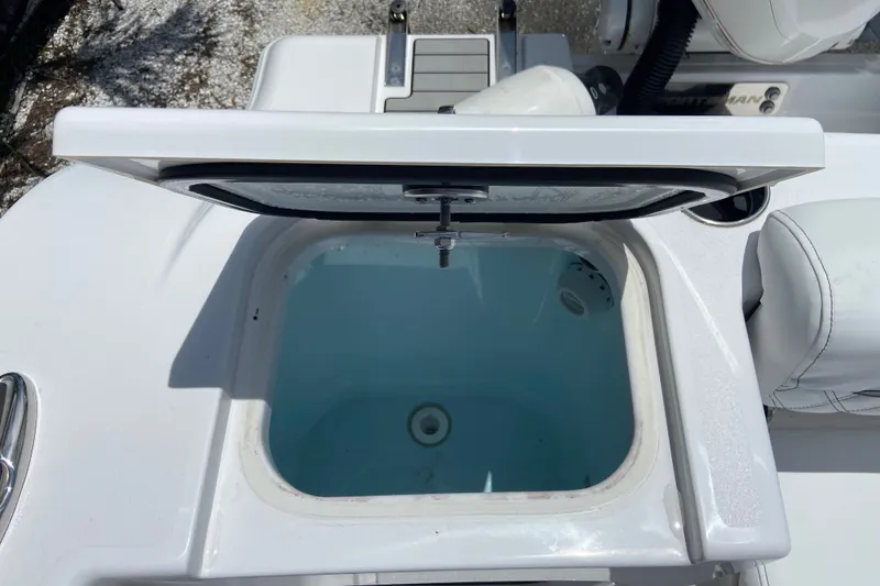 Slide: The Image of Open livewell on 2026 Sportsman Open 322 Center Console boat, showcasing interior design. - 5