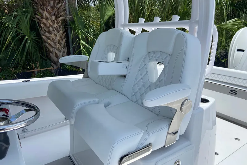Slide: The Image of Luxurious seating on 2026 Sportsman Open 322 Center Console boat, featuring elegant white upholstery. - 19