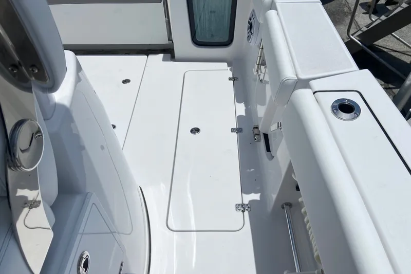 Slide: The Image of 2026 Sportsman Open 322 Center Console boat deck, featuring sleek white design and modern fittings. - 9