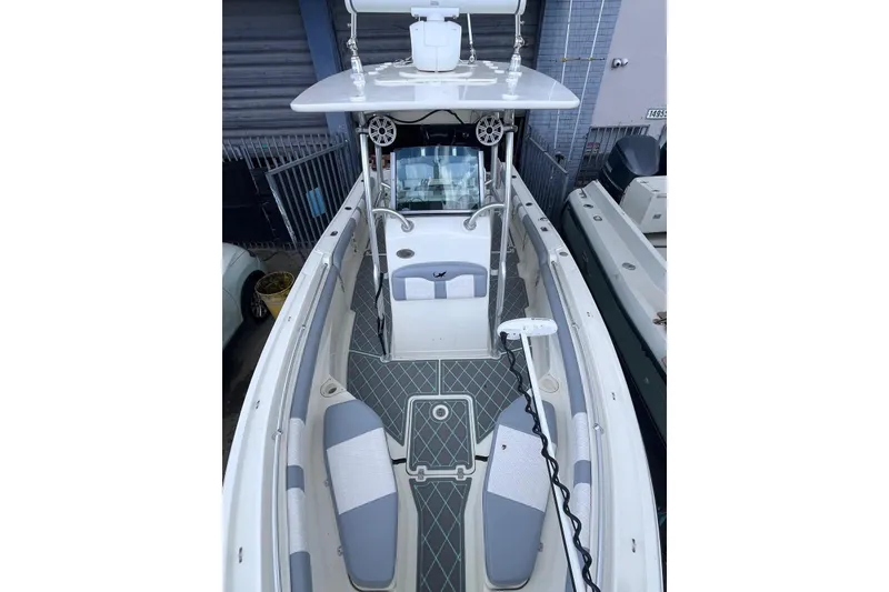 Slide: The Image of 2019 Mako 234 Center Console boat with spacious deck and modern design. - 2