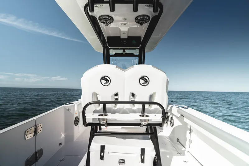 Slide: The Image of 2026 Edgewater 250CC boat cruising on open water under clear blue sky. - 6