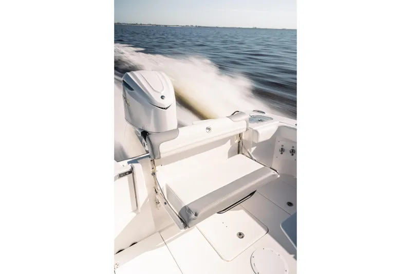 Slide: The Image of 2026 Edgewater 250CC boat cruising on open water, featuring sleek seating and modern design. - 7