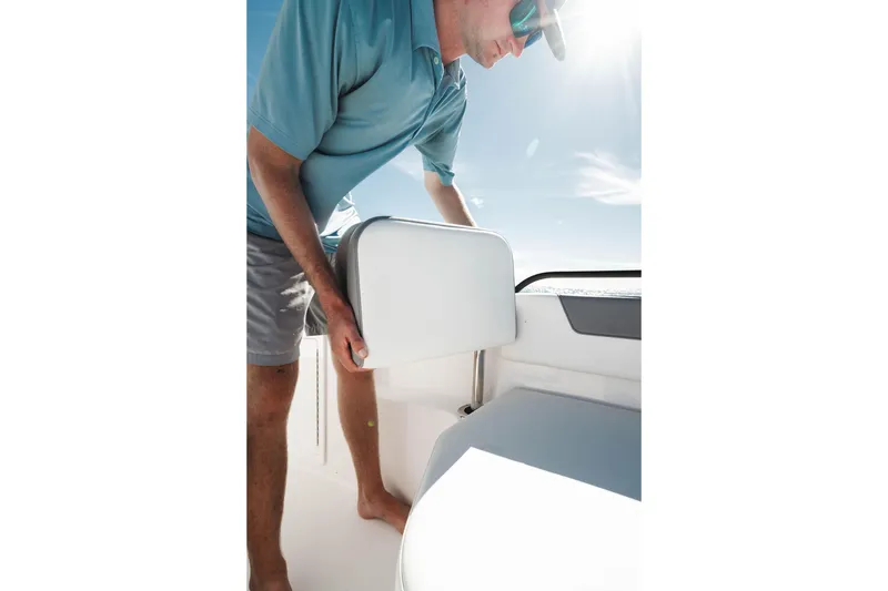 Slide: The Image of 2026 Edgewater 250CC boat interior with ocean view, featuring modern seating and equipment. - 9