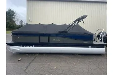 The Image of 2021 Barletta C22QC pontoon boat with cover, parked outdoors. - 0