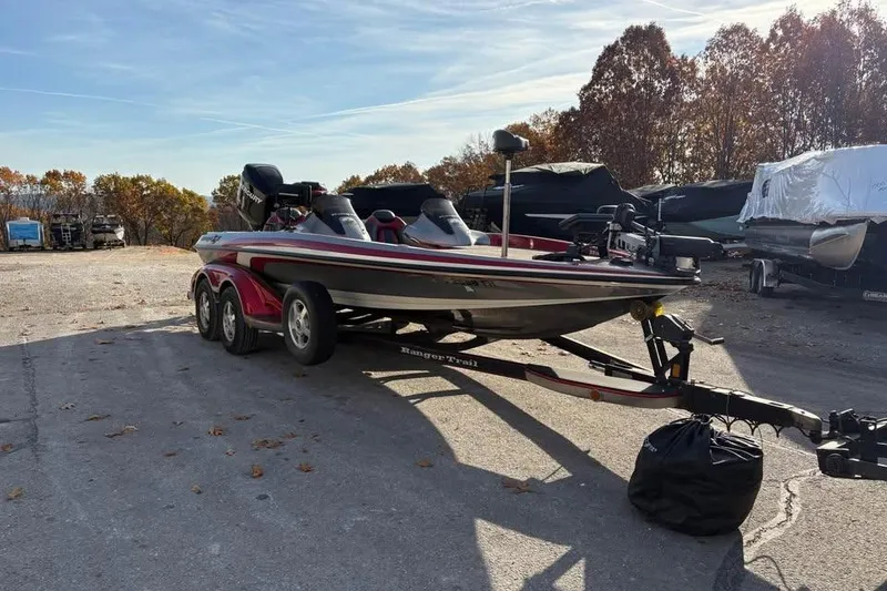 Slide: The Image of 2011 Ranger Z118 Comanche boat on trailer in outdoor storage area. - 5
