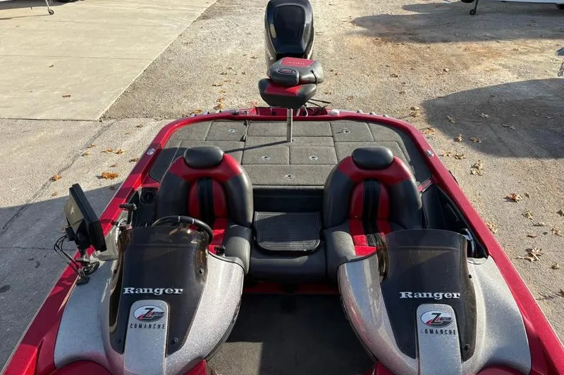 Slide: The Image of 2011 Ranger Z118 Comanche boat interior with dual seats and control panel. - 9
