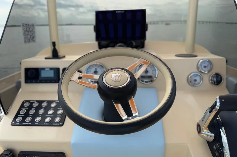 Slide: The Image of Steering wheel and dashboard of 2026 Lilybaeum Levanzo 25 Lounge Deck boat. - 14