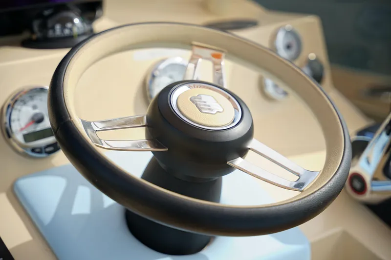 Slide: The Image of Steering wheel of 2026 Lilybaeum Levanzo 25 Lounge Deck boat with dashboard instruments. - 15