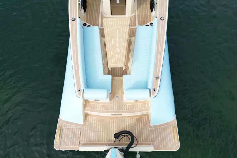 Slide: The Image of 2026 Lilybaeum Levanzo 25 Lounge Deck boat with elegant seating on calm water. - 25