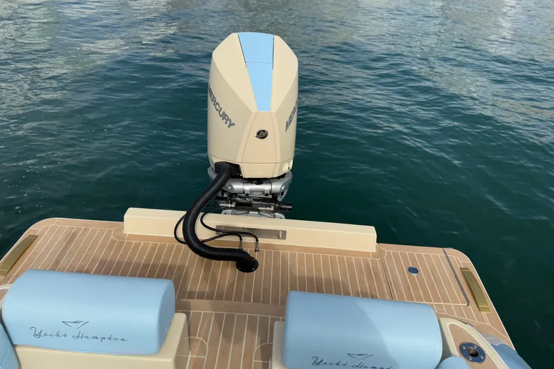 Slide: The Image of Lilybaeum Levanzo 25 Lounge Deck 2026 with Mercury engine on calm water. - 29