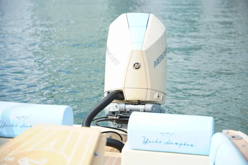 Slide: The Image of 2026 Lilybaeum Levanzo 25 Lounge Deck with Mercury outboard motor on water. - 30