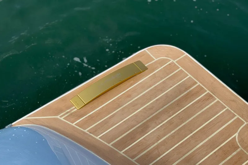 Slide: The Image of Lilybaeum Levanzo 25 Lounge Deck 2026, featuring elegant wood finish near water. - 31