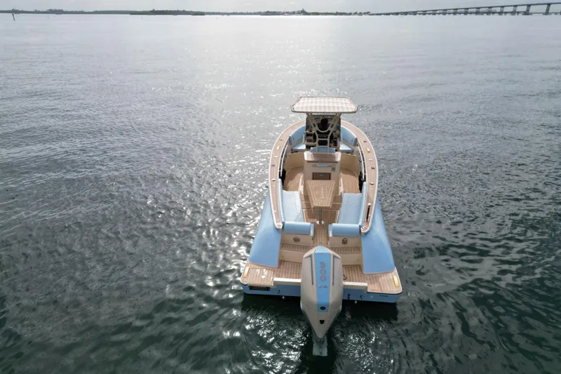Slide: The Image of Lilybaeum Levanzo 25 Lounge Deck 2026 boat on calm water, aerial view. - 5