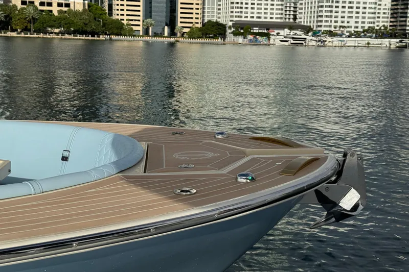 Slide: The Image of Lilybaeum Levanzo 25 Lounge Deck 2026 boat on calm water near cityscape. - 7