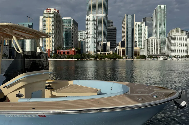 Slide: The Image of Lilybaeum Levanzo 25 Lounge Deck 2026 boat with city skyline backdrop. - 8