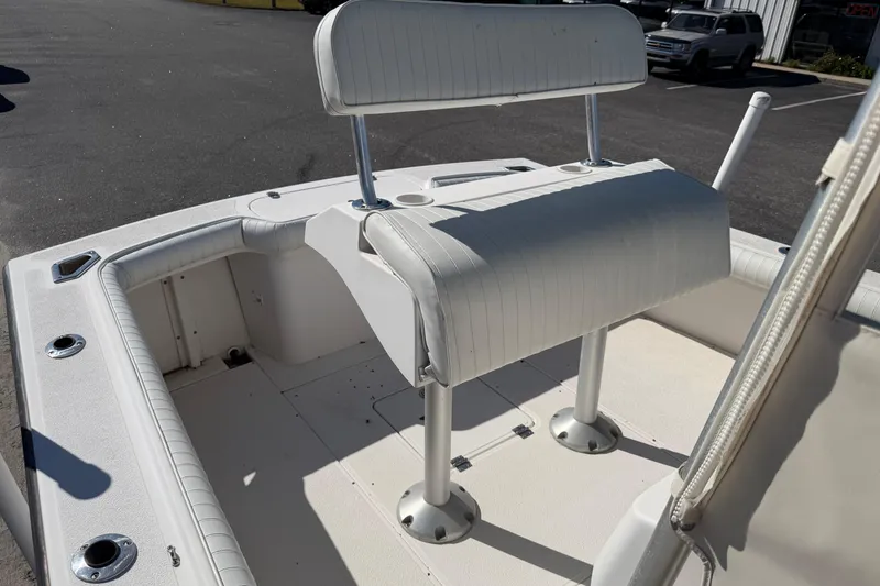 Slide: The Image of 2006 Shamrock 220 Stalker boat interior with white seating and deck. - 16