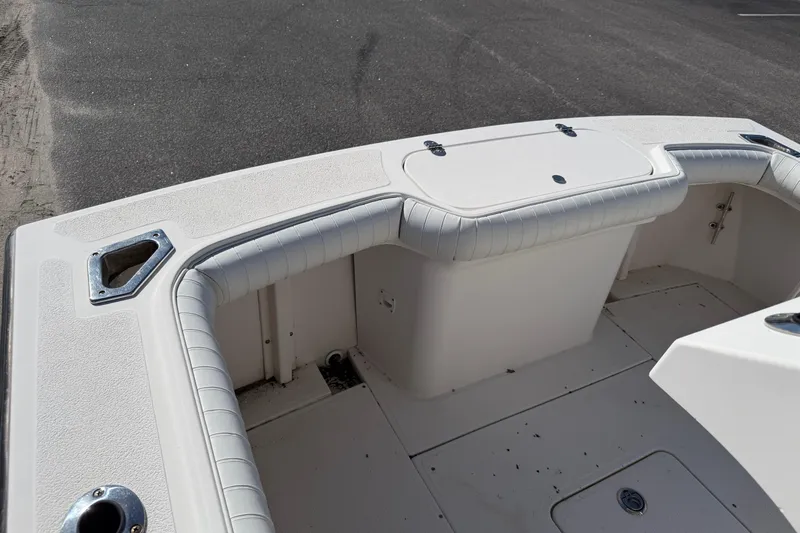 Slide: The Image of 2006 Shamrock 220 Stalker boat interior with rod holders and Garmin equipment. - 23