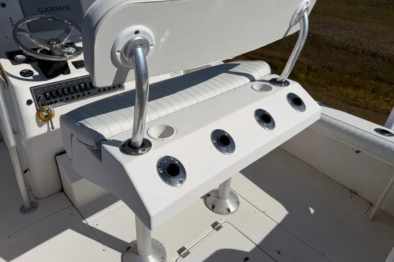 Slide: The Image of Interior view of a 2006 Shamrock 220 Stalker boat, featuring seating and storage compartments. - 25