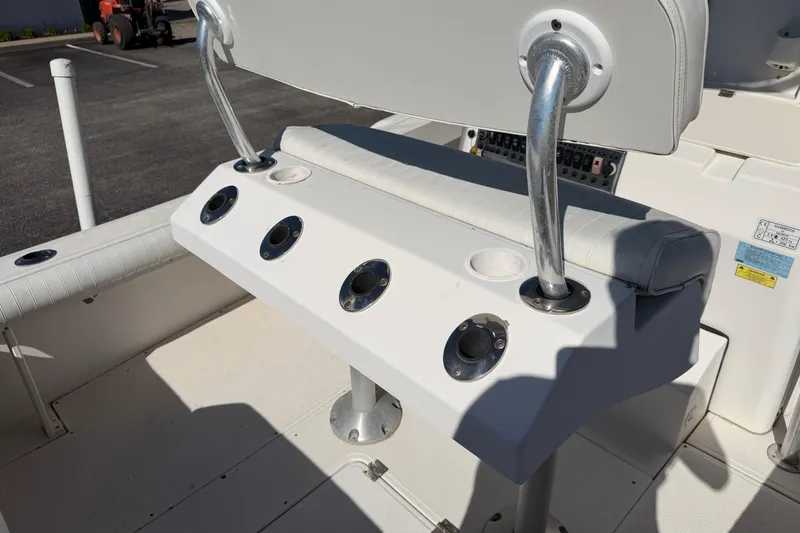 Slide: The Image of Engine compartment of a 2006 Shamrock 220 Stalker boat, showing mechanical components. - 26