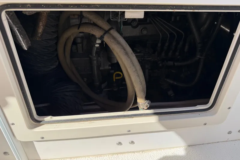 Slide: The Image of 2006 Shamrock 220 Stalker boat interior with rod holders and seating. - 29