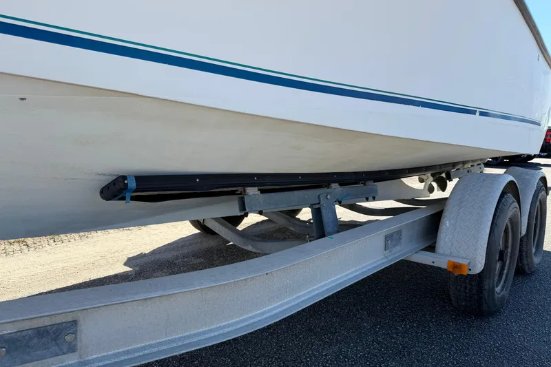 Slide: The Image of Rear view of a 2006 Shamrock 220 Stalker boat on a trailer. - 32
