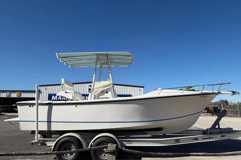 Slide: The Image of 2006 Shamrock 220 Stalker boat with Yanmar diesel engine on trailer. - 4