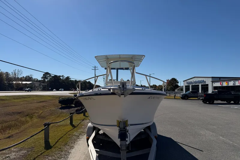 Slide: The Image of 2006 Shamrock 220 Stalker boat, rear view, parked near service center. - 7
